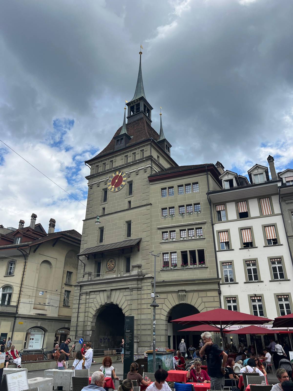The Käfigturm with café umbrellas below