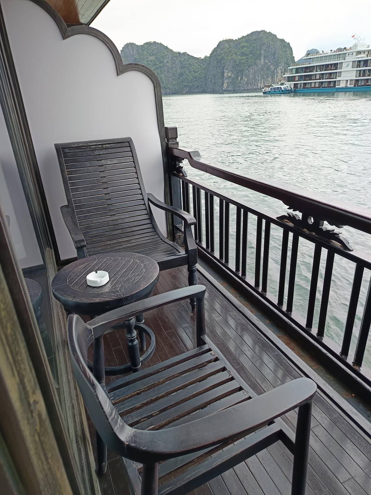 Two chairs on a private cabin balcony