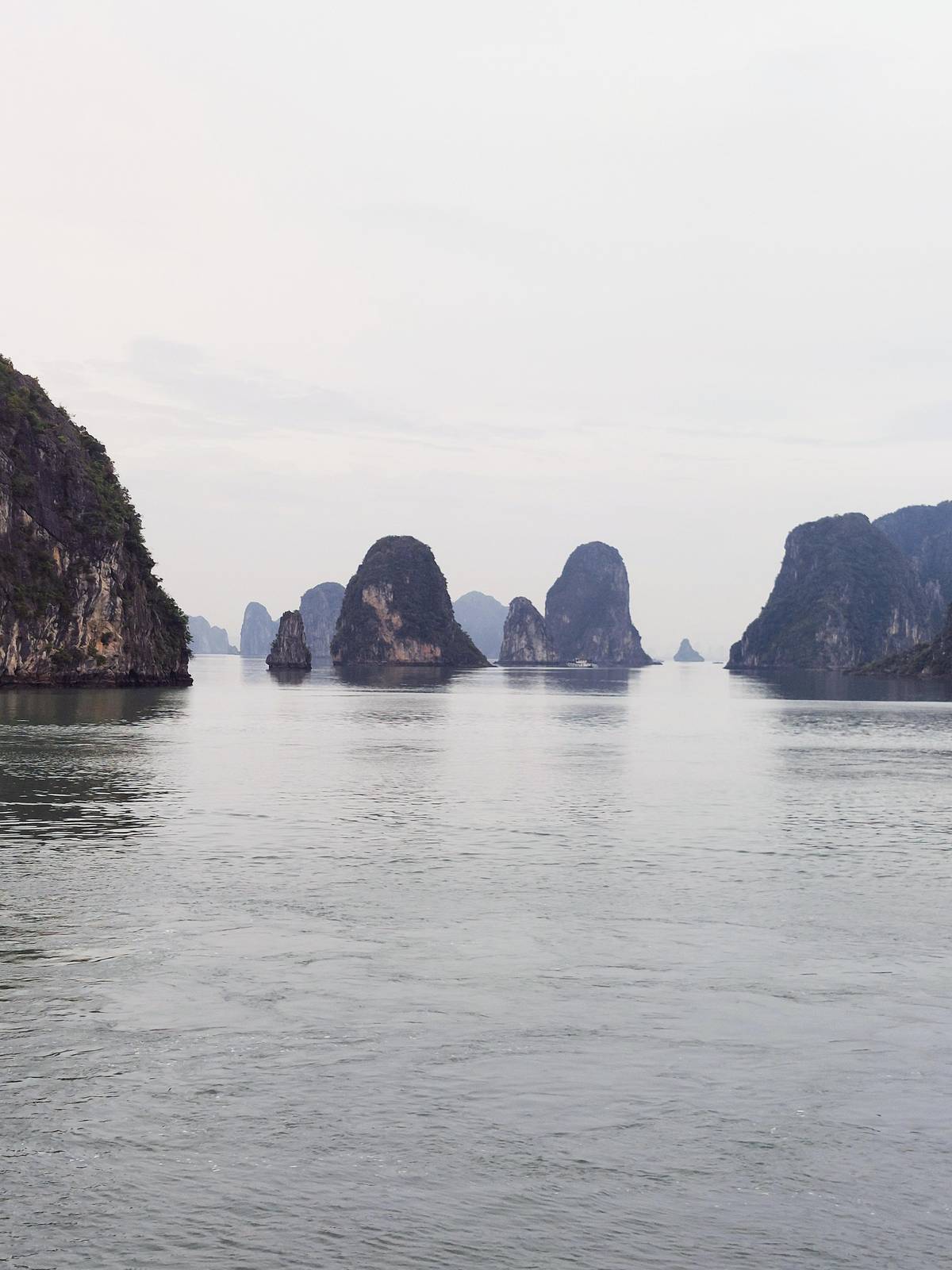 Limestone islets rising from calm water