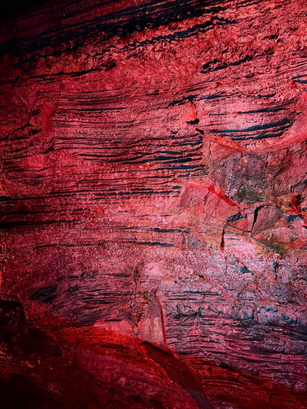 Red-lit layers of lava along the wall