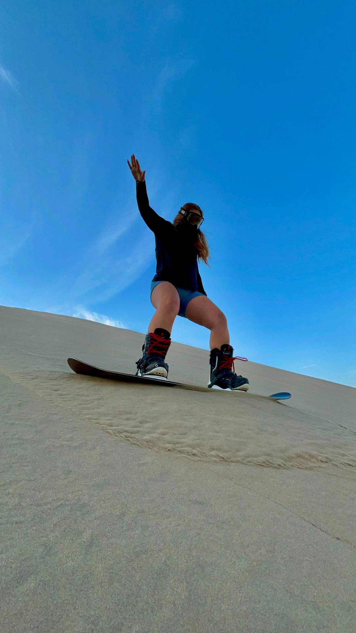 Sandboard or sandski at sunset, Huacachina