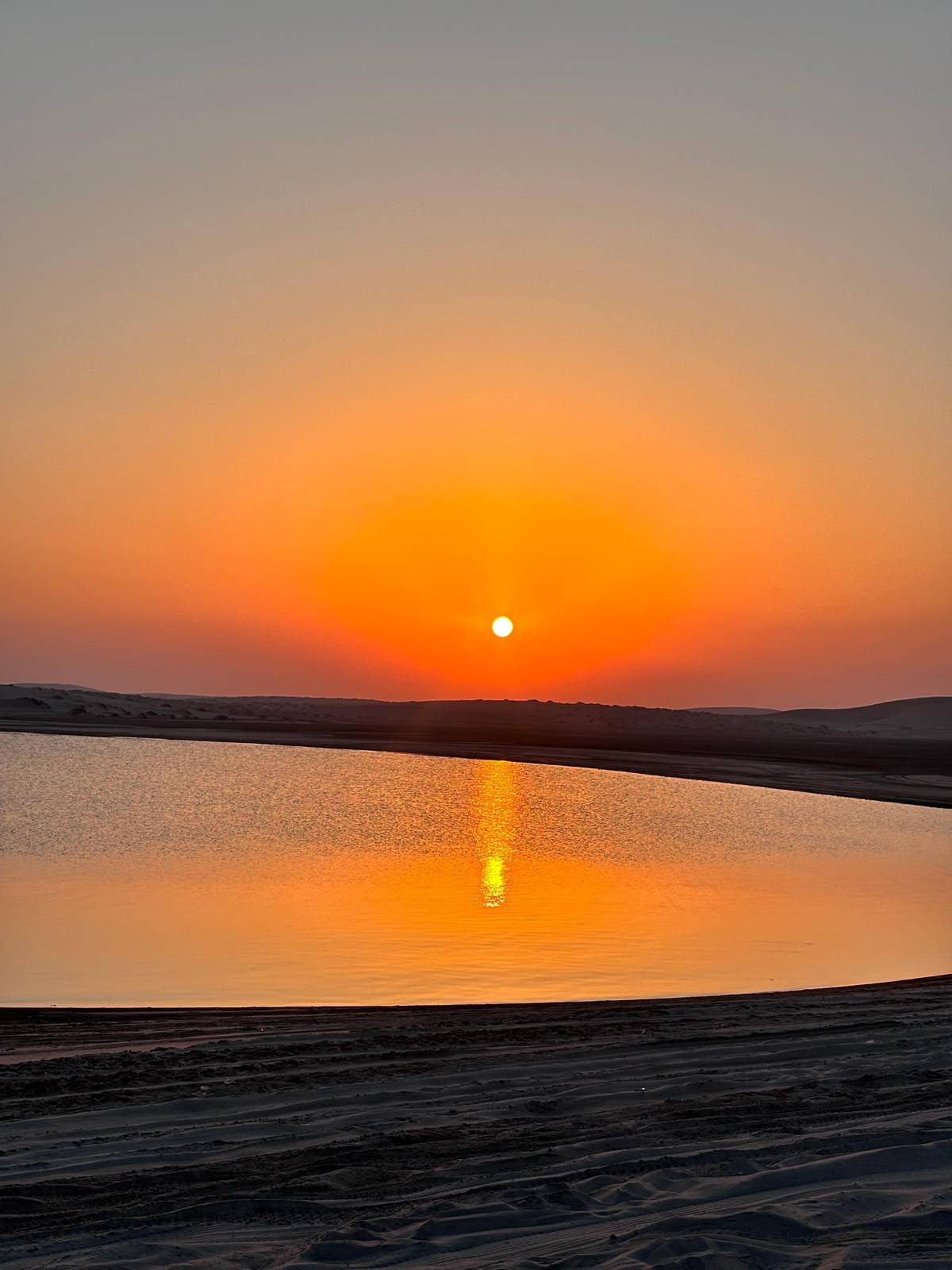 The sun setting over the still water of the Inland Sea