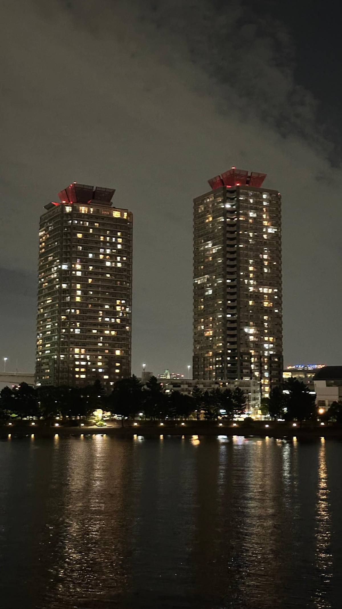 Waterfront towers lit along the bay