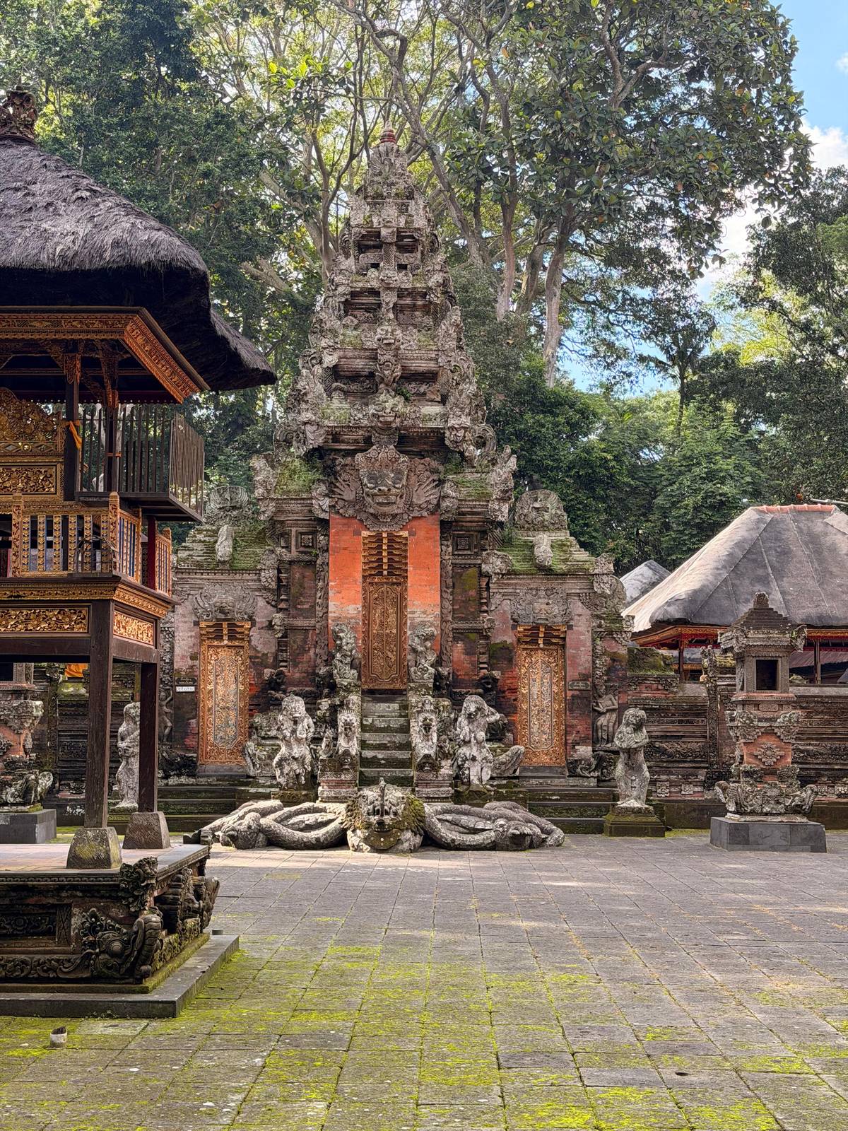 A carved temple gate in the forest sanctuary