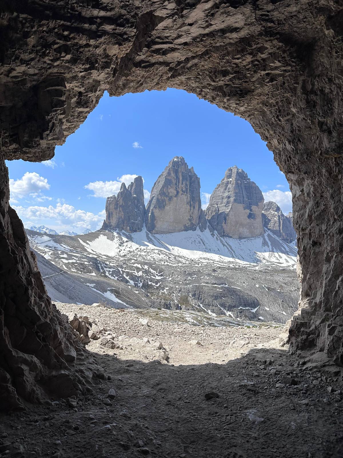 The three peaks framed by a rock window on the plateau