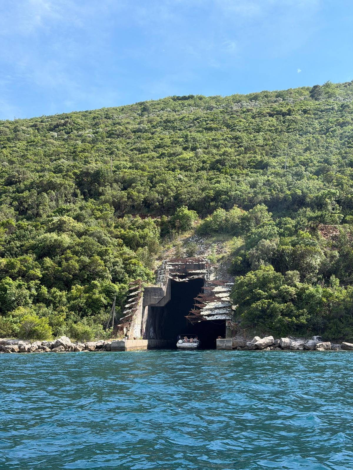 The entrance of a submarine tunnel in the green shore