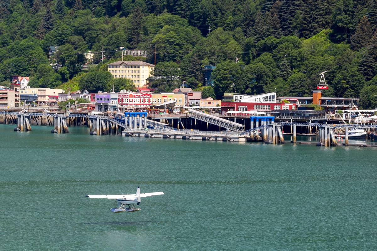 A floatplane taking off in front of the waterfront