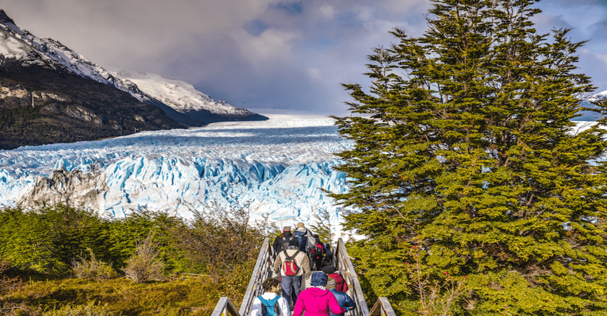 Visitors on the walkway stairs toward the glacier