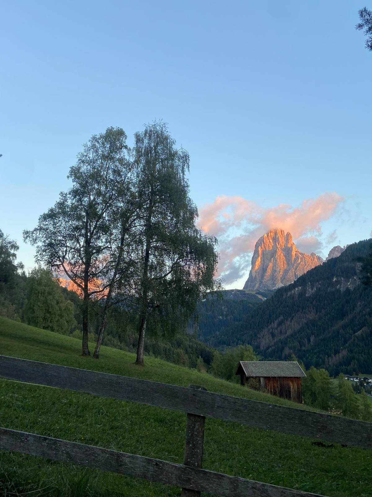 Sassolungo glowing at sunset above Val Gardena