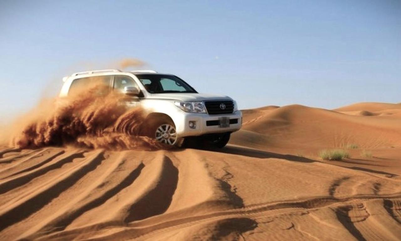 Doha: Desert Safari Dune Bashing, Sandboarding, & Camel Ride