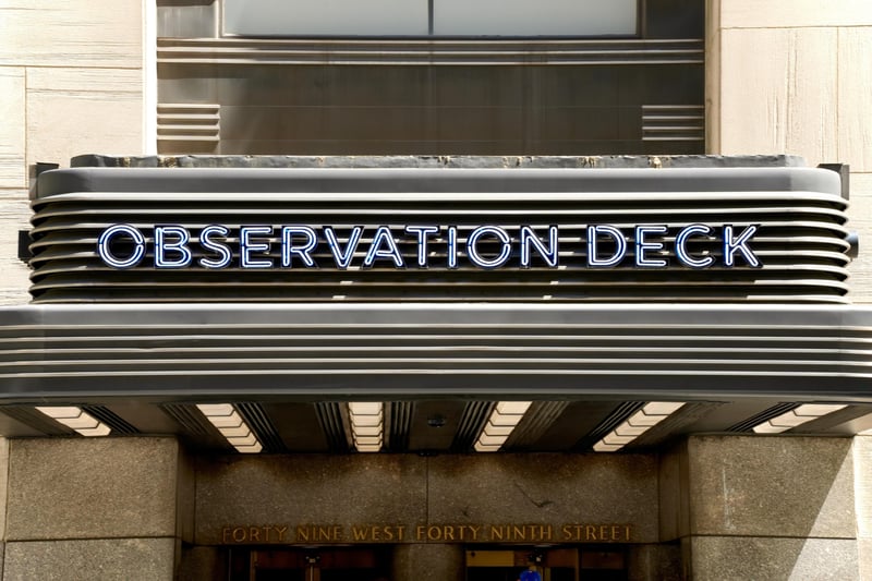 The lit OBSERVATION DECK marquee over the entrance at 30 Rockefeller Plaza