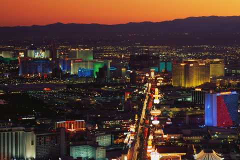 Downtown Las Vegas Skyline at Night with city lights and mountains