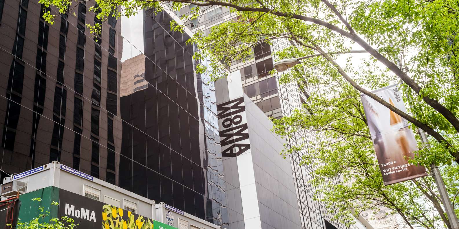 MoMA interior spaces and visitors exploring exhibitions