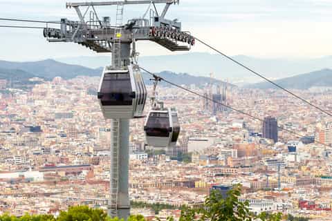 Cable car gliding above Barcelona toward Montjuïc hill