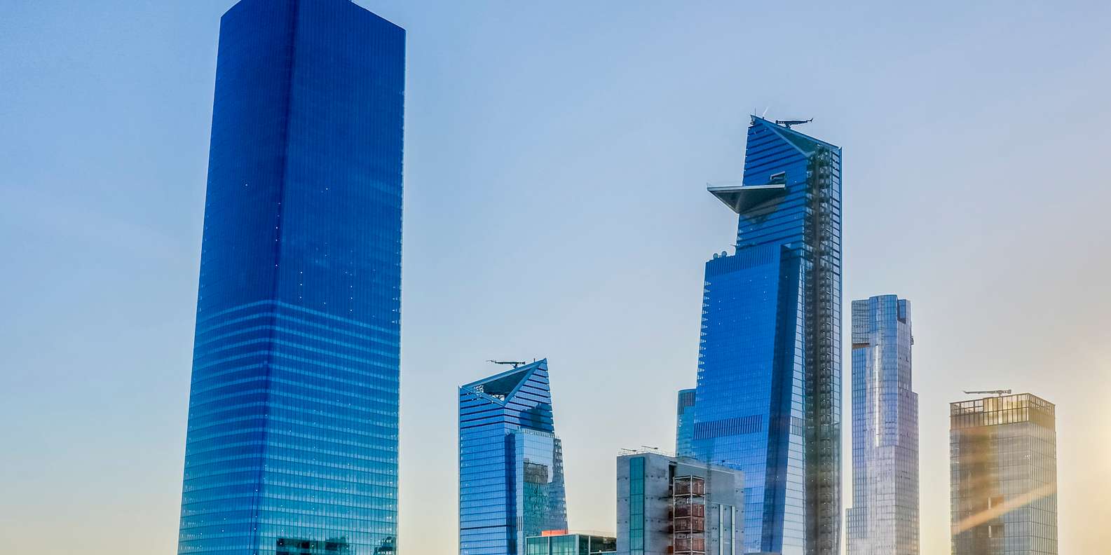 Edge angled glass walls leaning over New York City