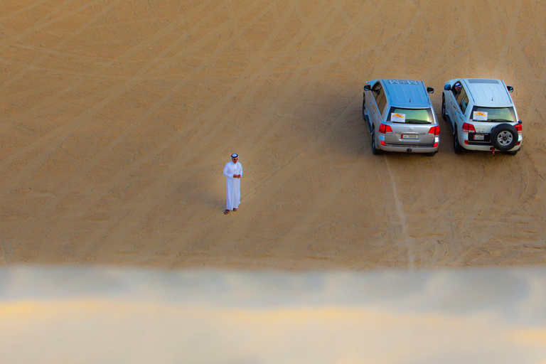 Gratis kamelenrit; Woestijnsafari dunebashing; ZandboardenWoestijnsafari bij zonsondergang aan de binnenzee