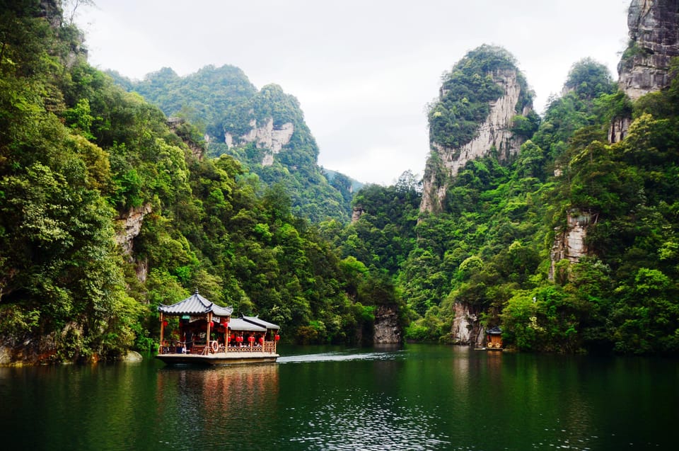 Private Day Tour to Yellow Dragon Cave & BaoFeng Lake - Housity