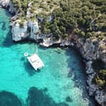 Porto Conte: tour di mezza giornata in catamarano con aperitivo