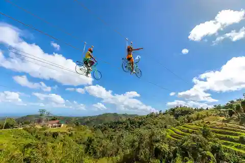 From San Juan: Zipline & Toro Bike Tour with Transportation