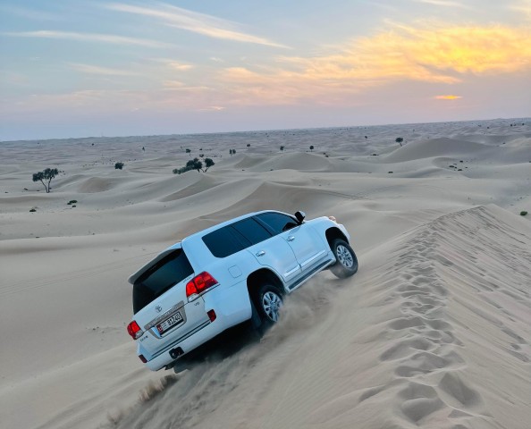 Visit Abu Dhabi Escape From City Desert Tour w/ Camel Ride & BBQ in Abu Dhabi, United Arab Emirates