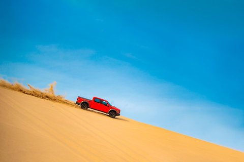 Doha: Arabic Costume, Desert Safari, Sandboarding & More Group Tour with Camel Ride in traditional Arabic Costume