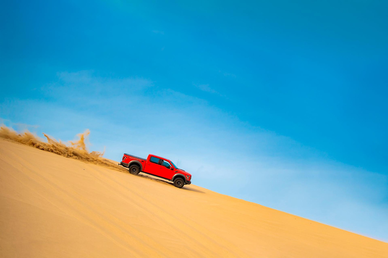 Doha: Arabic Costume, Desert Safari, Sandboarding & More Group Tour with Camel Ride in traditional Arabic Costume