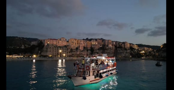 From Tropea sunset boat tour to Capo Vaticano with aperitif