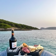 Alghero : excursion en bateau avec apéritif au coucher du soleil à Porto Conte