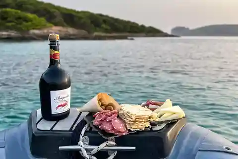 Alghero: båttur med aperitiff ved solnedgang Porto Conte