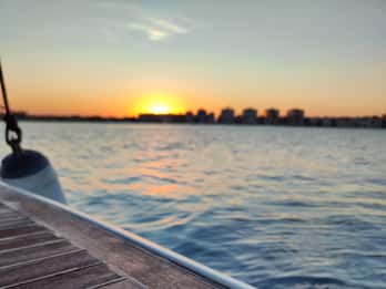 Sailing with sunset and swim in the sea