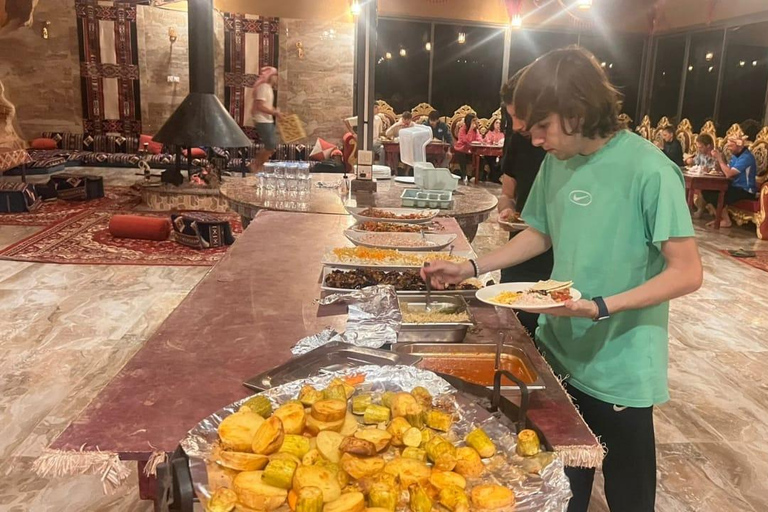 overnight: sleep under the stars in the cave in Wadi Rum Protected Area Caml tour