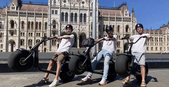 Top sights of Pest downtown on e-scooters incl. Parliament