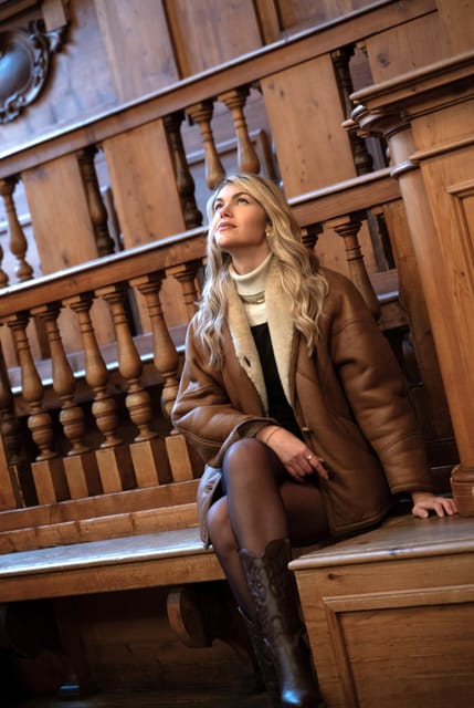 Carved wooden tiers and statues surrounding the historic Anatomical Theatre in Bologna