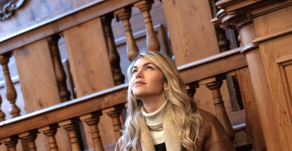 Carved wooden tiers and statues surrounding the historic Anatomical Theatre in Bologna