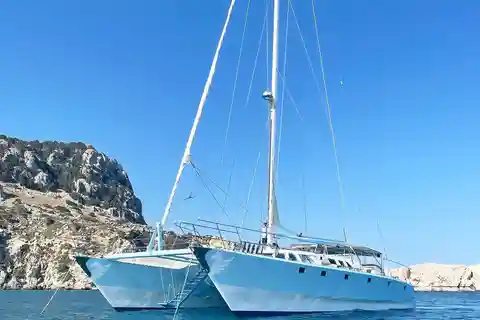 From Rhodes: Half-Day Catamaran Cruise with Swim Stops