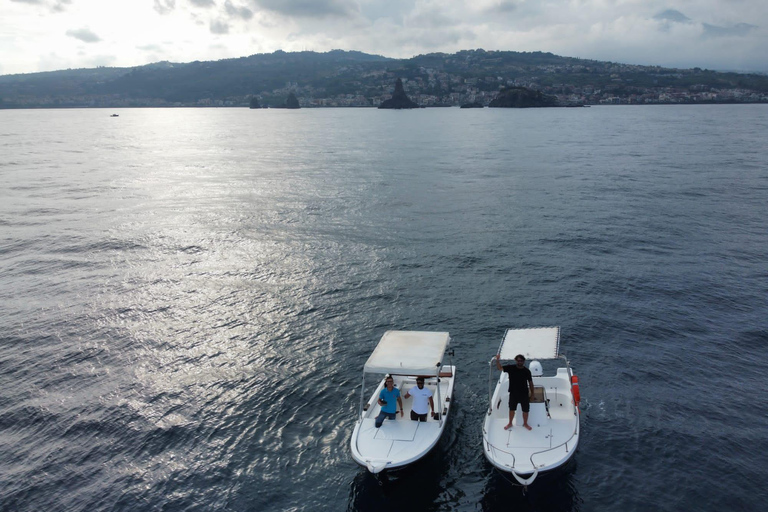 boat tour exploring and searching for dolphins in Acitrezza