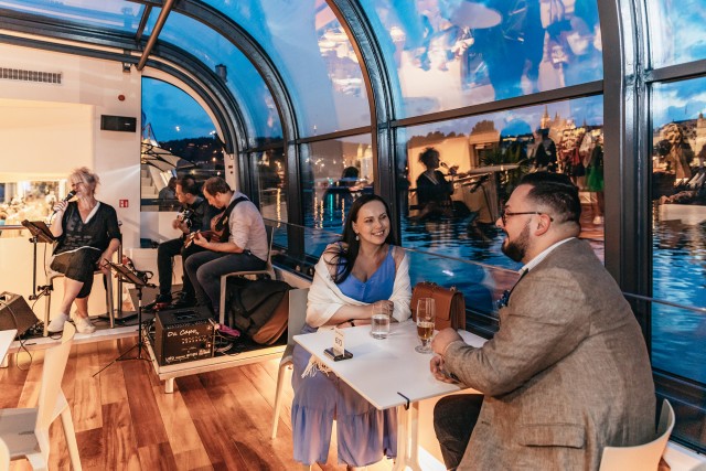 Visit Prague Sightseeing Dinner Cruise on Open-Top Glass Boat in Praga