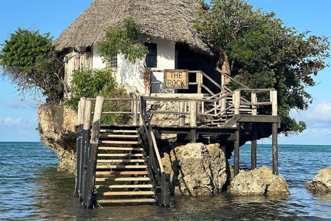 Zanzibar: laguna blu, ristorante sulla roccia, grotta e spiaggia