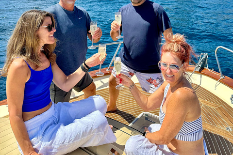 Capri Boat Tour with Caves, Swimming, Aperitif and Champagne From Capri: PRIVATE Capri Boat Tour
