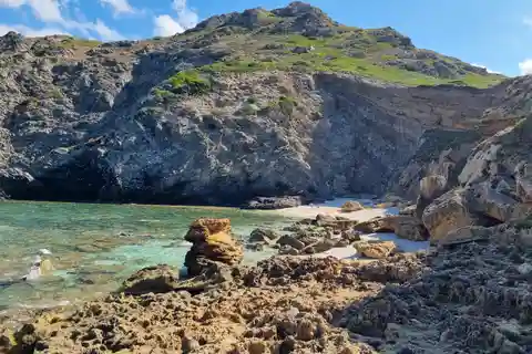 Alghero: Spiagge segrete e tour costiero via terra
