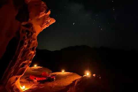 overnight: sleep under the stars in the cave in Wadi Rum Protected Area Caml tour