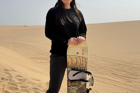 Doha: Arabic Costume, Desert Safari, Sandboarding & More Group Tour with Camel Ride in traditional Arabic Costume
