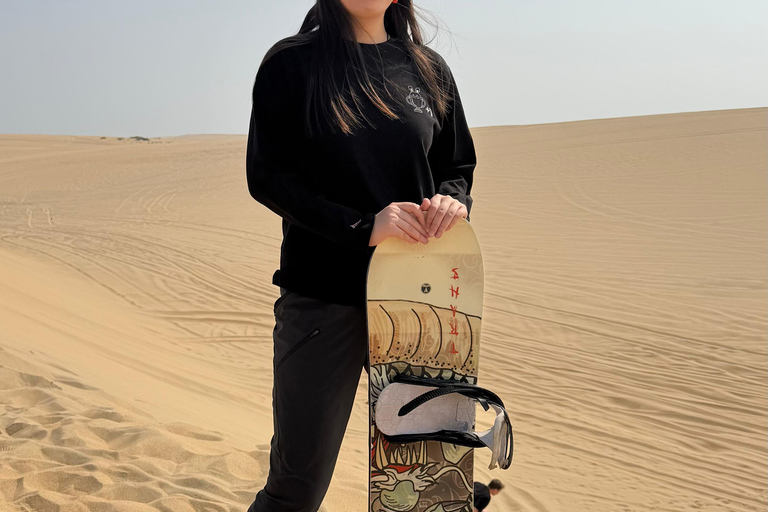 Doha: Arabic Costume, Desert Safari, Sandboarding & More Group Tour with Camel Ride in traditional Arabic Costume