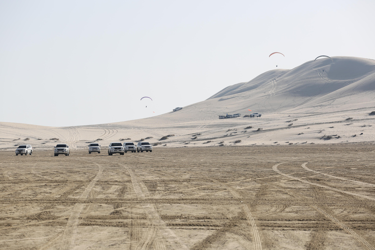 Gratis kamelenrit; Woestijnsafari dunebashing; ZandboardenWoestijnsafari bij zonsondergang aan de binnenzee