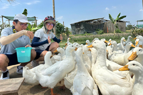 Hoi An Bike Tour: Ride a Buffalo & Duck Farming Experience Hoi An Bike-Organic Farm-Duck game-ride Buffalo-Basket boat