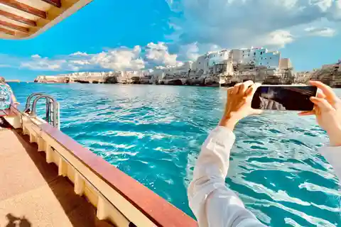 Polignano Monopoli: boat tour on a traditional wooden boat at sunset