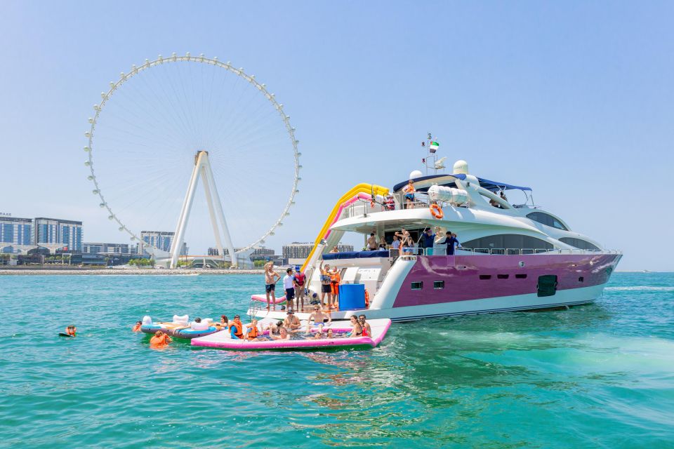 Dubai: Yacht Ride & Slide, Swim & Snorkel with BBQ Lunch | GetYourGuide