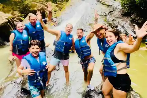San Juan: Rainforest Waterslides & Beach Tour with Transport