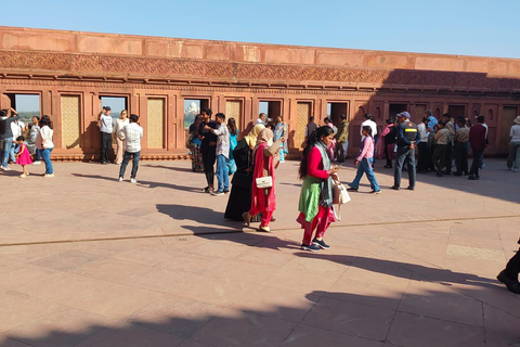From Delhi: Sunrise Taj Mahal & Agra Fort Day Trip by AC Car Tour Guide Services Only