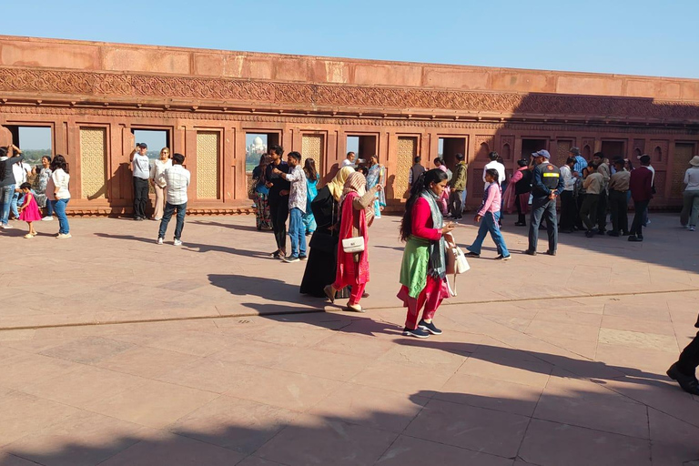 From Delhi: Sunrise Taj Mahal & Agra Fort Day Trip by AC Car Tour Guide Services Only